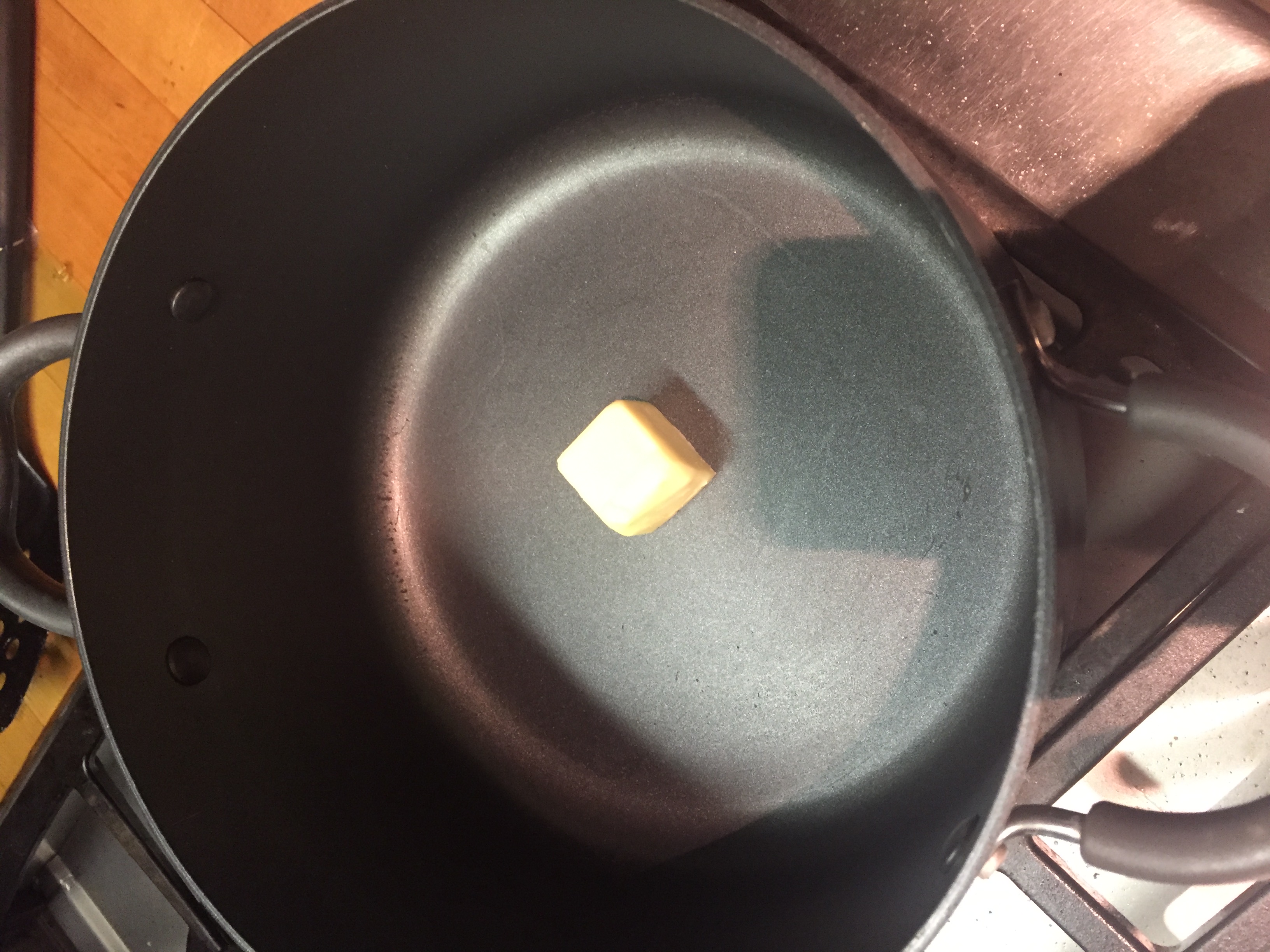 2 Tbsp salted butter into pot on medium heat.JPG