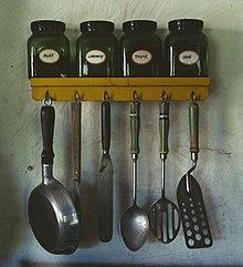 220px-Kitchen_utensils_hanging_below_a_spice_rack.jpg