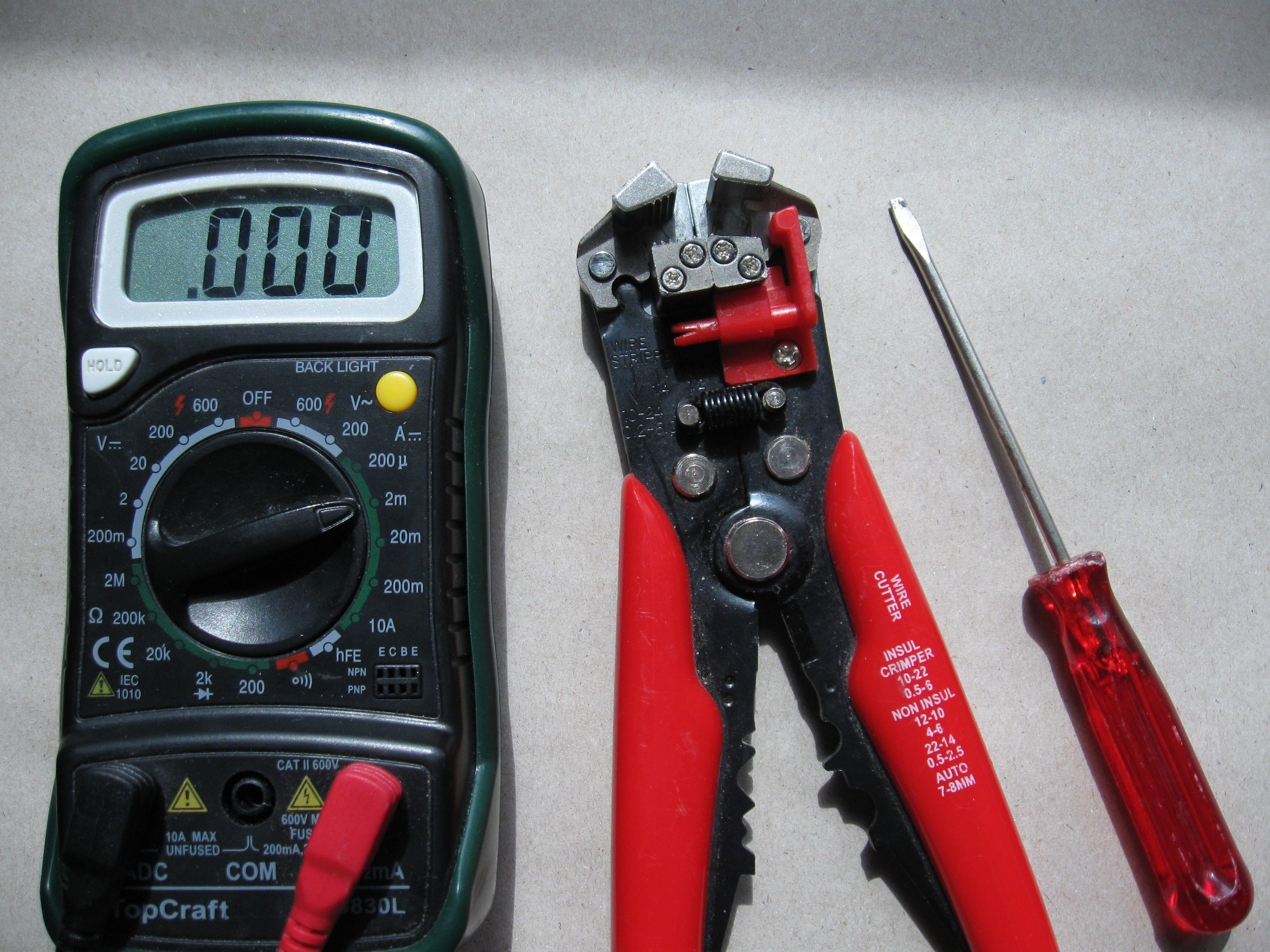 A multimeter (aka measure-thingey), and a wire stripper.JPG