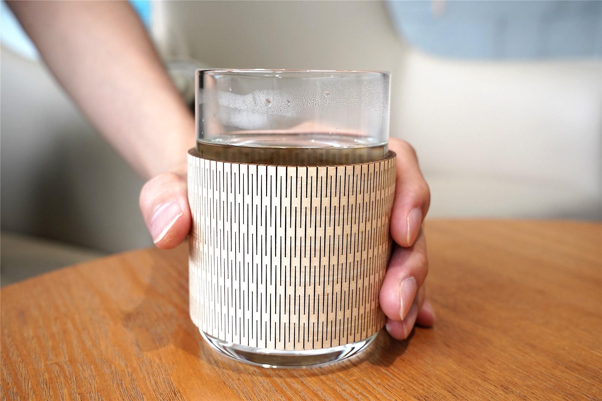 A picture of a laser-cut wooden cup sleeve.jpg
