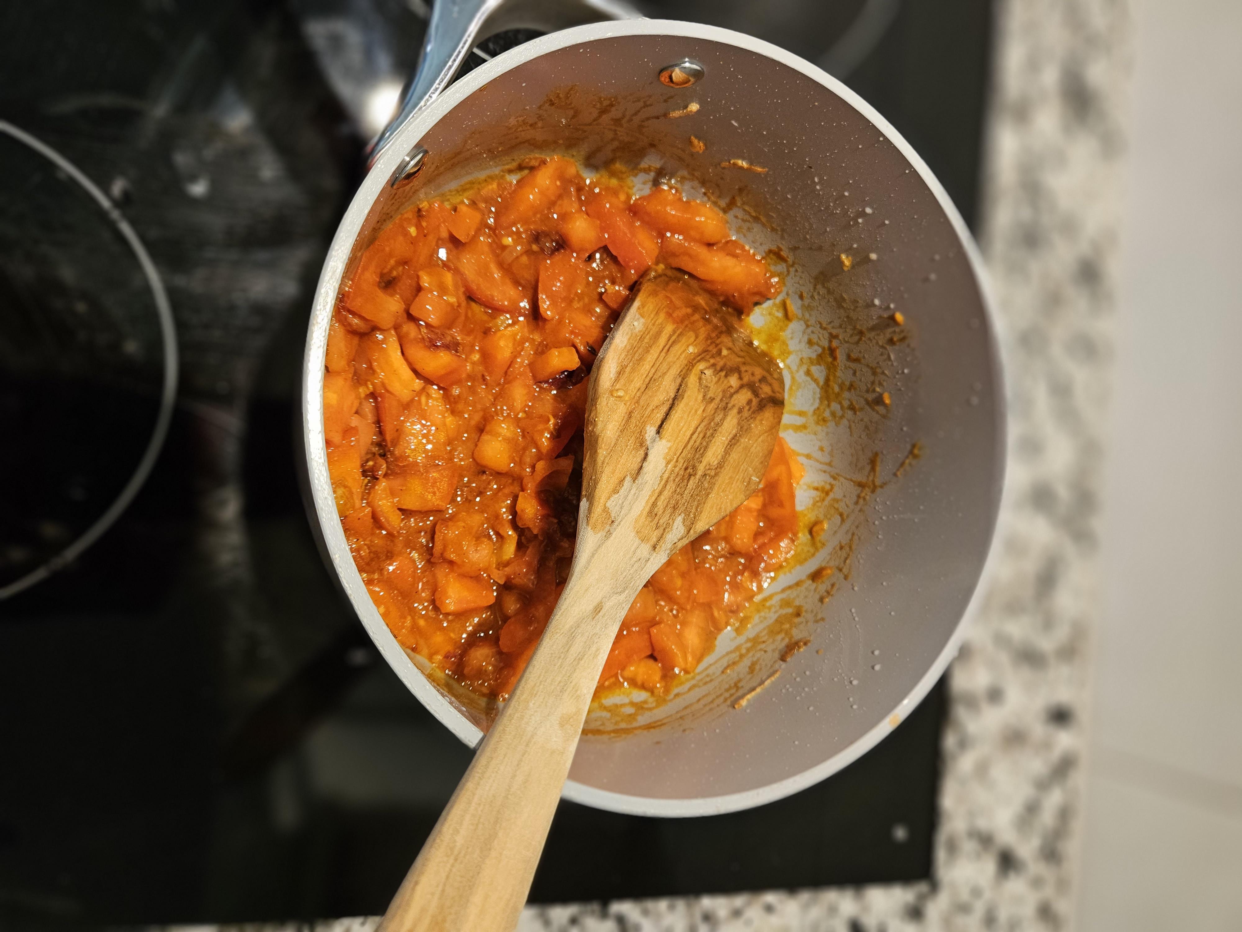 All spices added and tomatoes cooking together.jpg