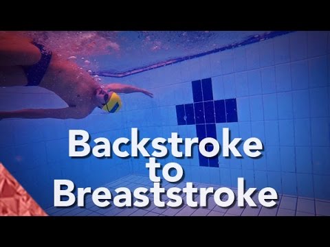 Backstroke to breaststroke swimming transition technique. Individual medley swimming