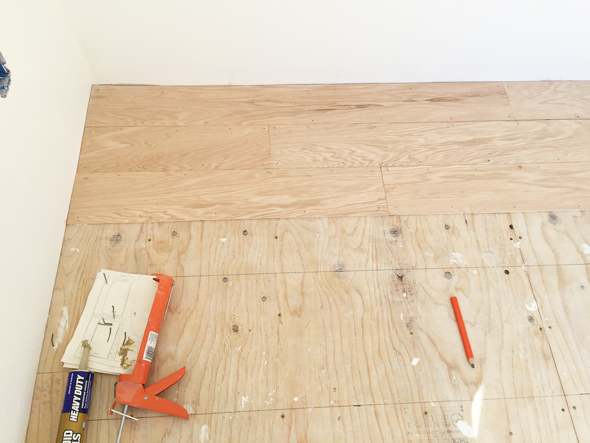 Backyard Art Studio DIY plywood floor.jpg