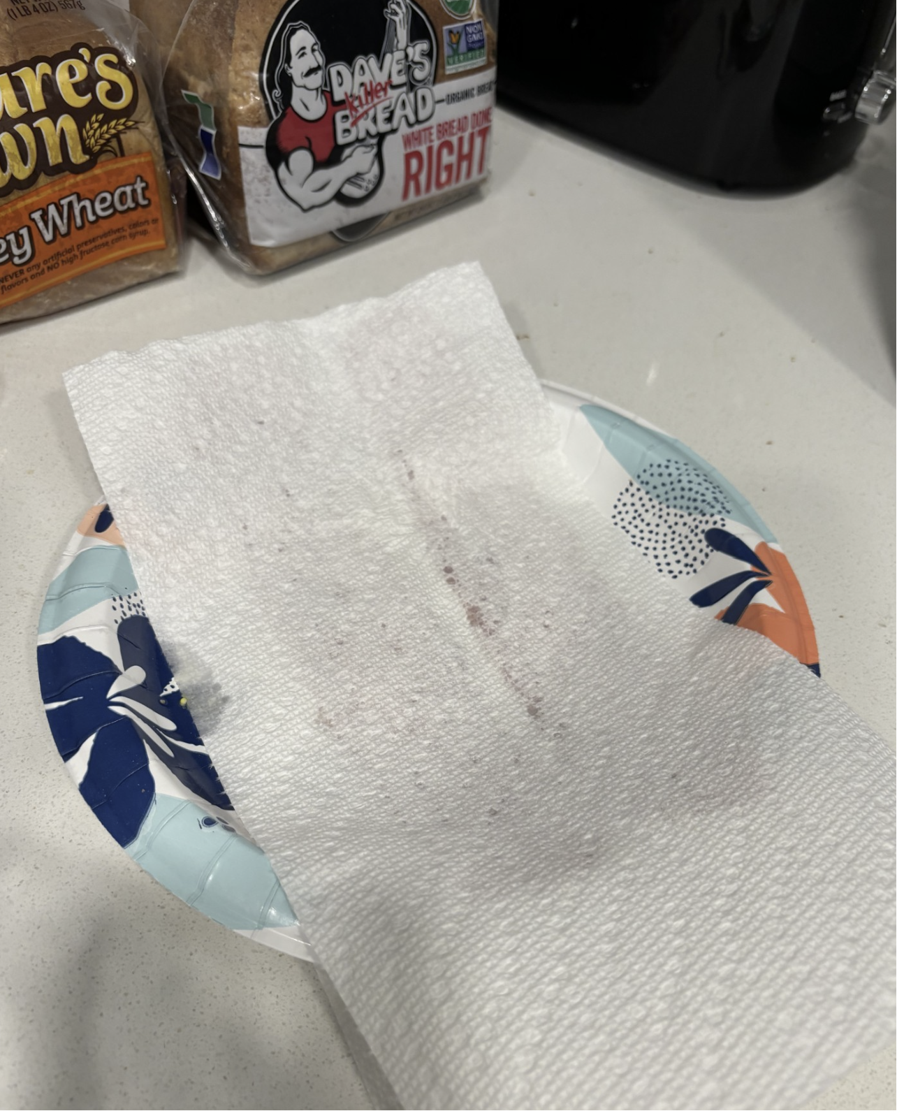 Bacon covered with paper towel.png