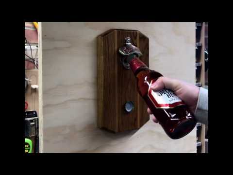 Bottle opener with magnetic top catcher