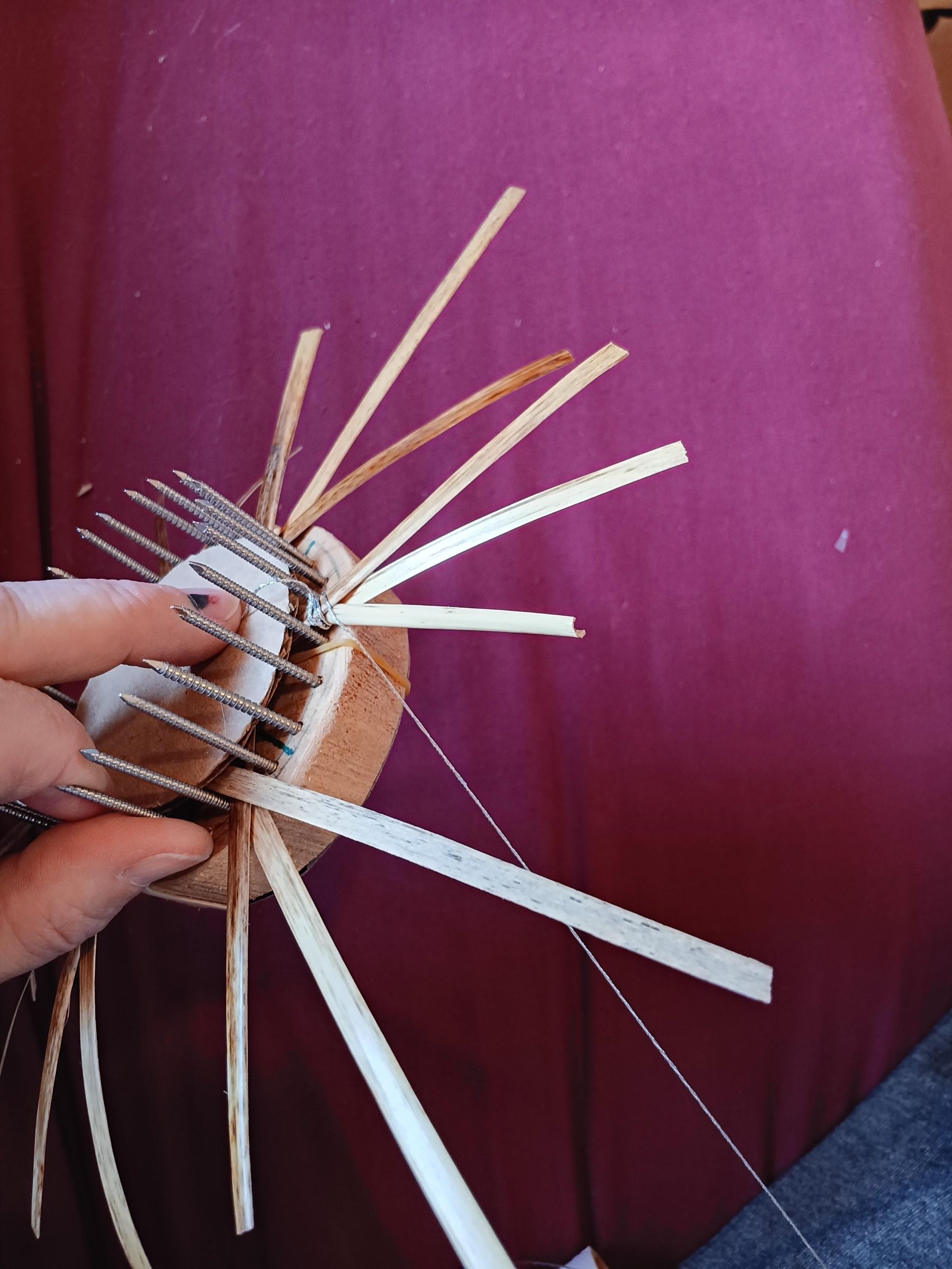C20_Weaving thread through straws.jpg