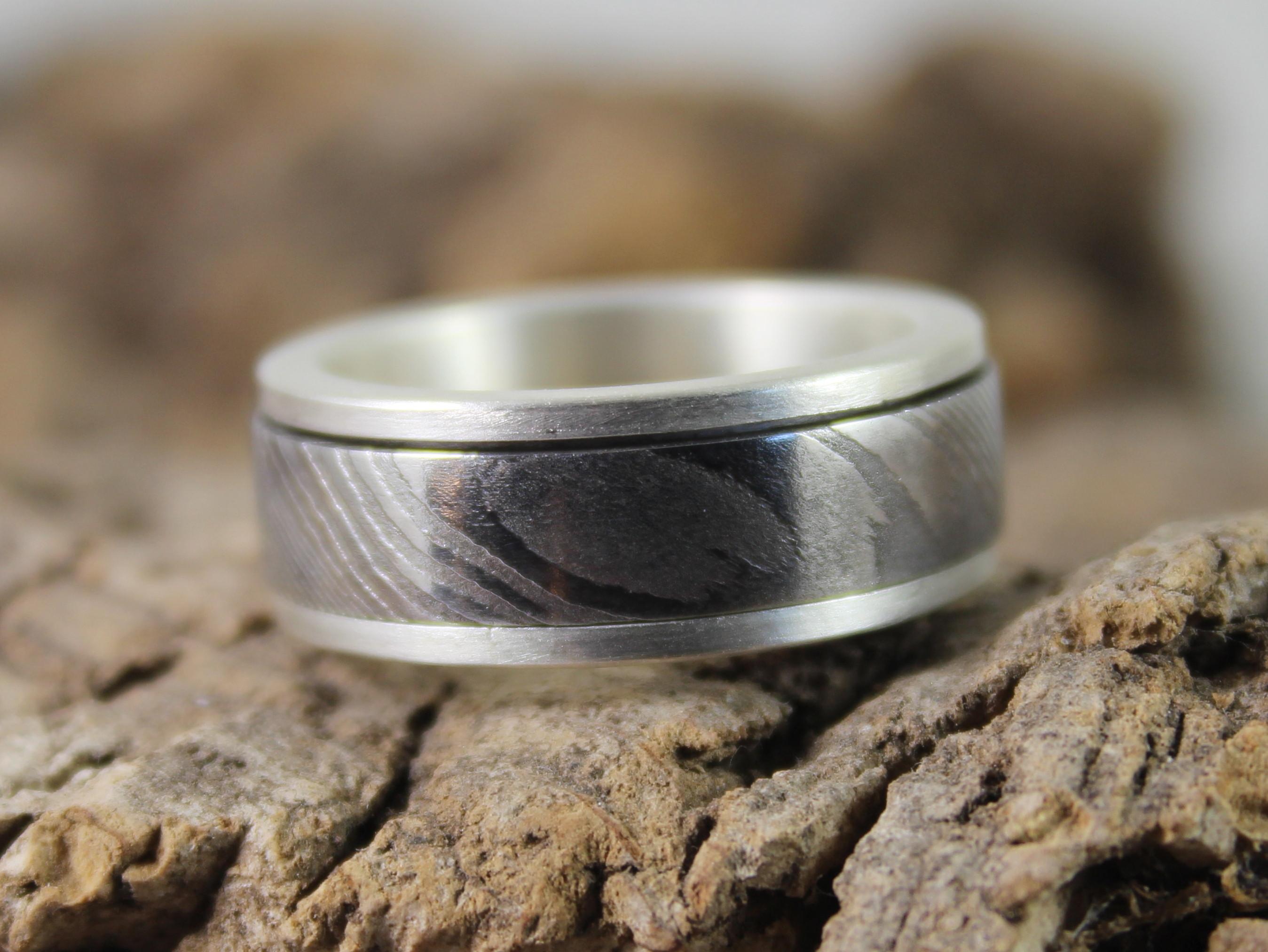 Damascus steel and silver spinner ring 1.JPG