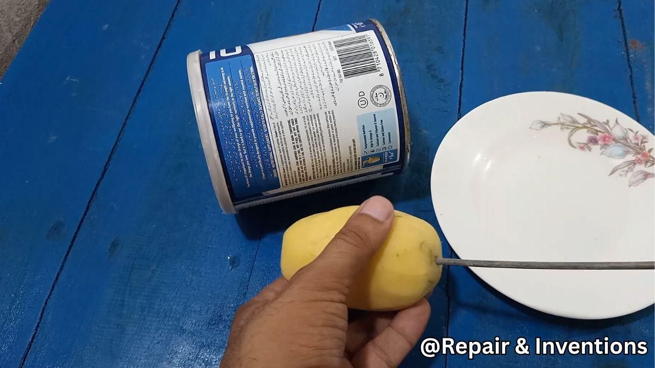 Fixing the Potato on the Rod.jpg