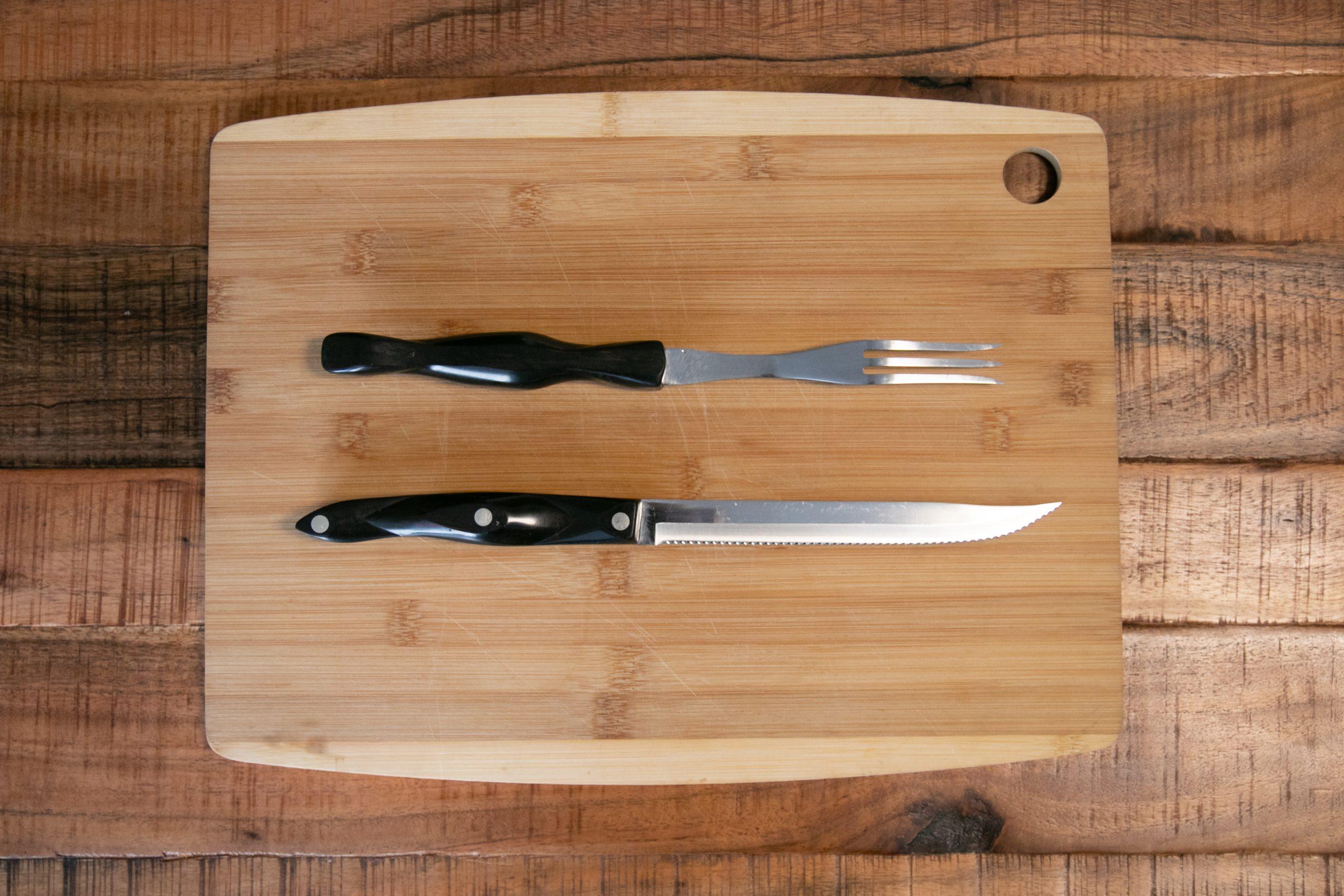 Fork-and-Knife-on-Wooden-Cutting-Board-scaled.jpg