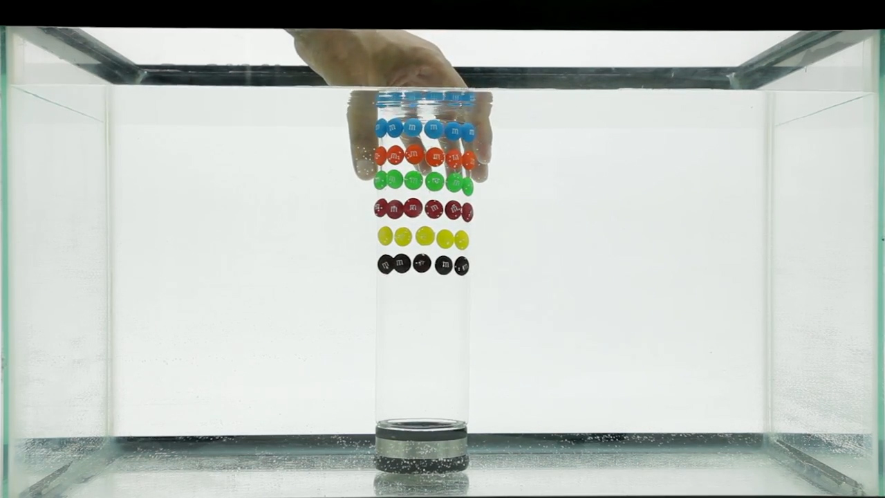 M&amp;M's RAINBOW WATERFALL EXPERIMENT  Reel Heat.00_00_47_29.Still007.jpg