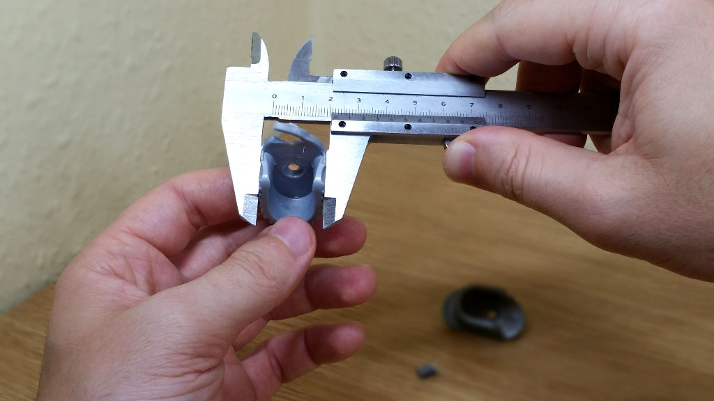 Measuring Broken Wardrobe Rail Bracket With Caliper.jpg