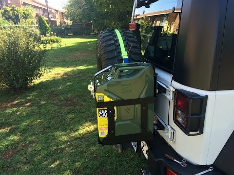 Non intrusive Jerrycan mount on a Jeep JK. No Cutting/Driling