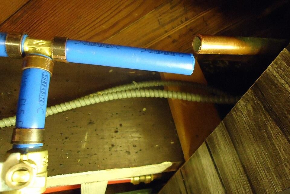 PEX_pipes_and_valves_in_basement_ceiling_for_exterior_water_spigot.jpg