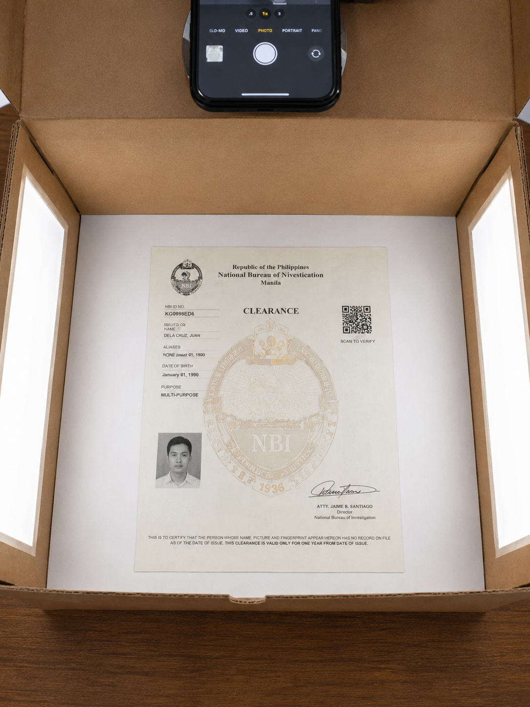 Photography setup with NBI clearance certificate.png