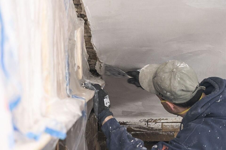 Plastering_around_historic_stenciling_(f58a1e0c-6f01-4a8a-b254-8b42fafde9c4).jpg