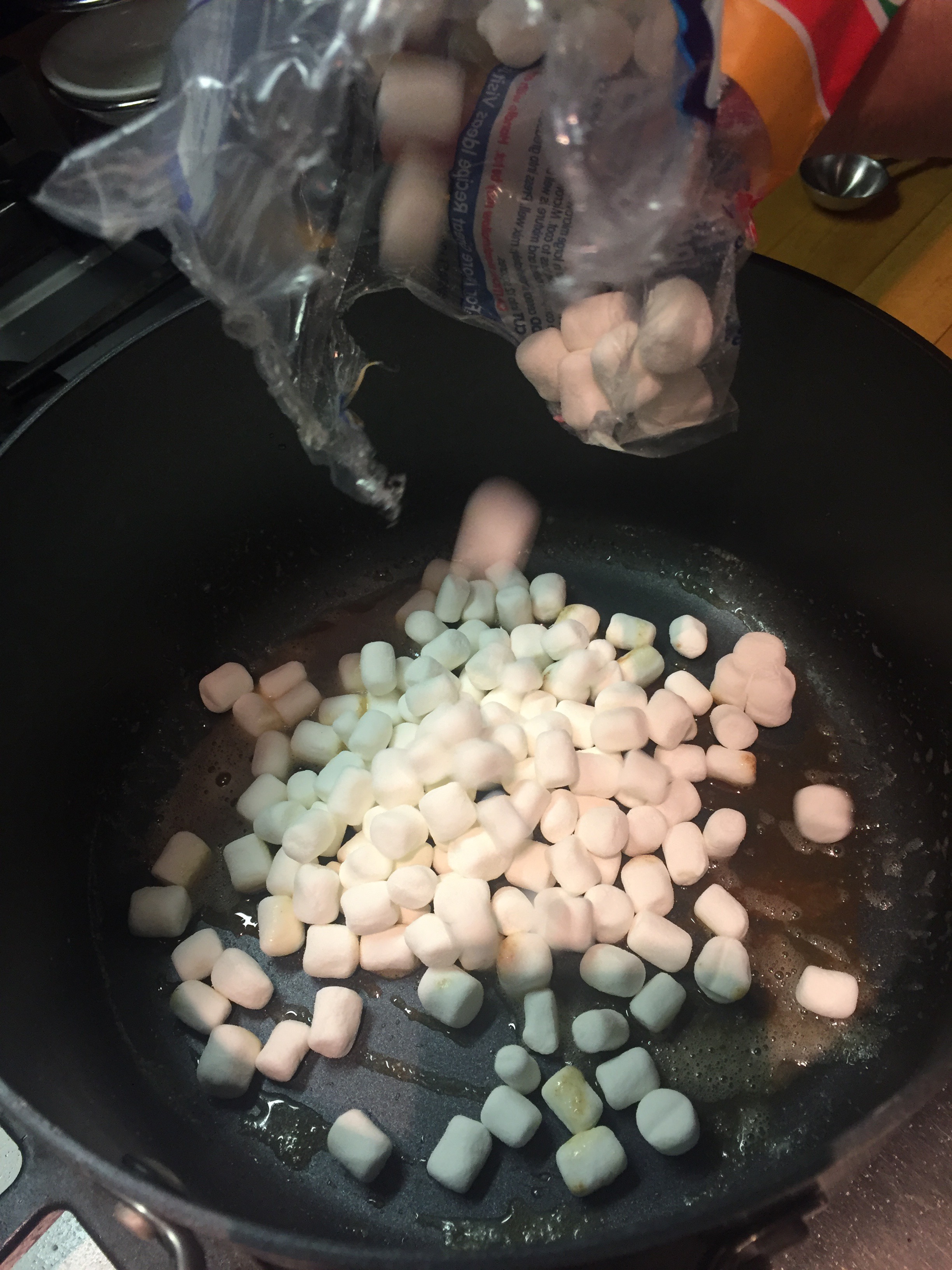 Pour 10 oz mini marshmellows into pot with browned butter.JPG