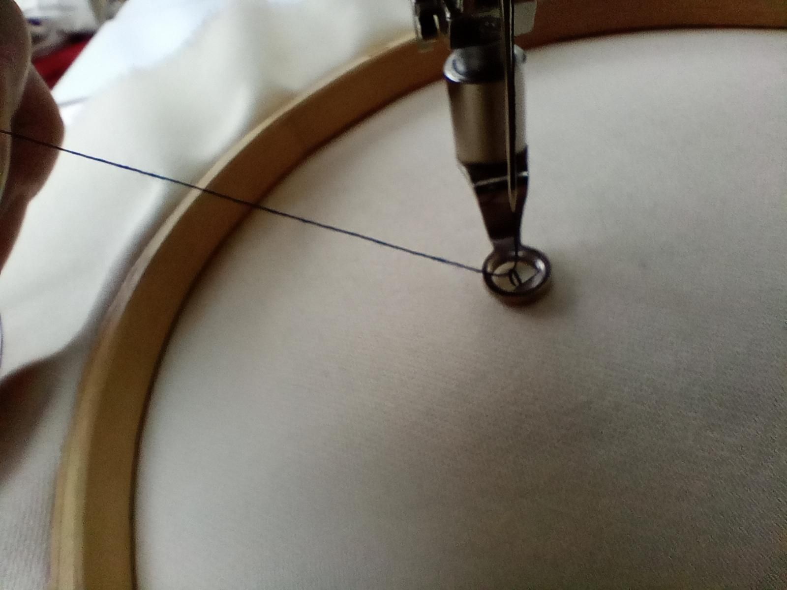 Pulling up the bobbin thread.jpg