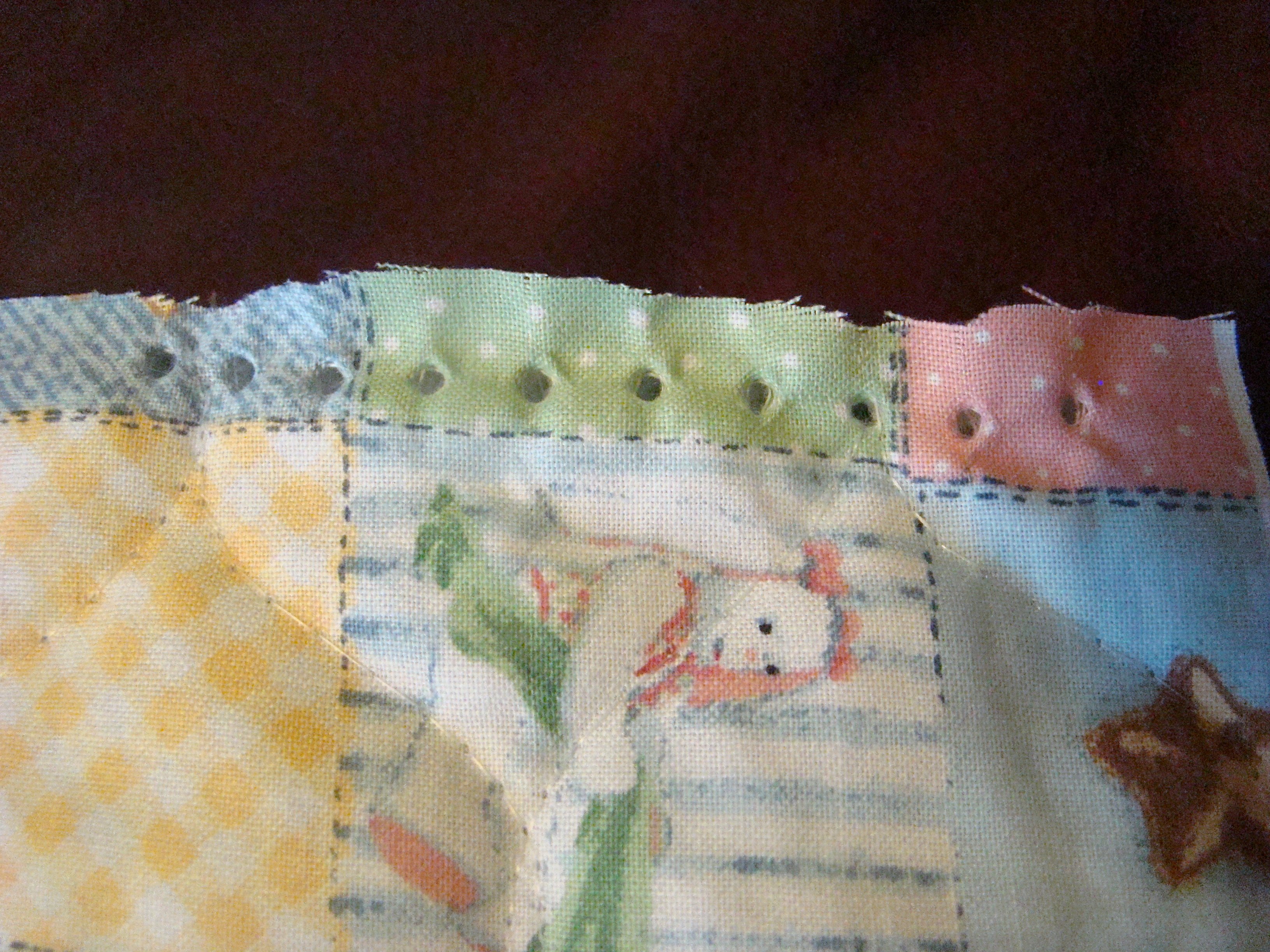 Quilt punch holes.JPG