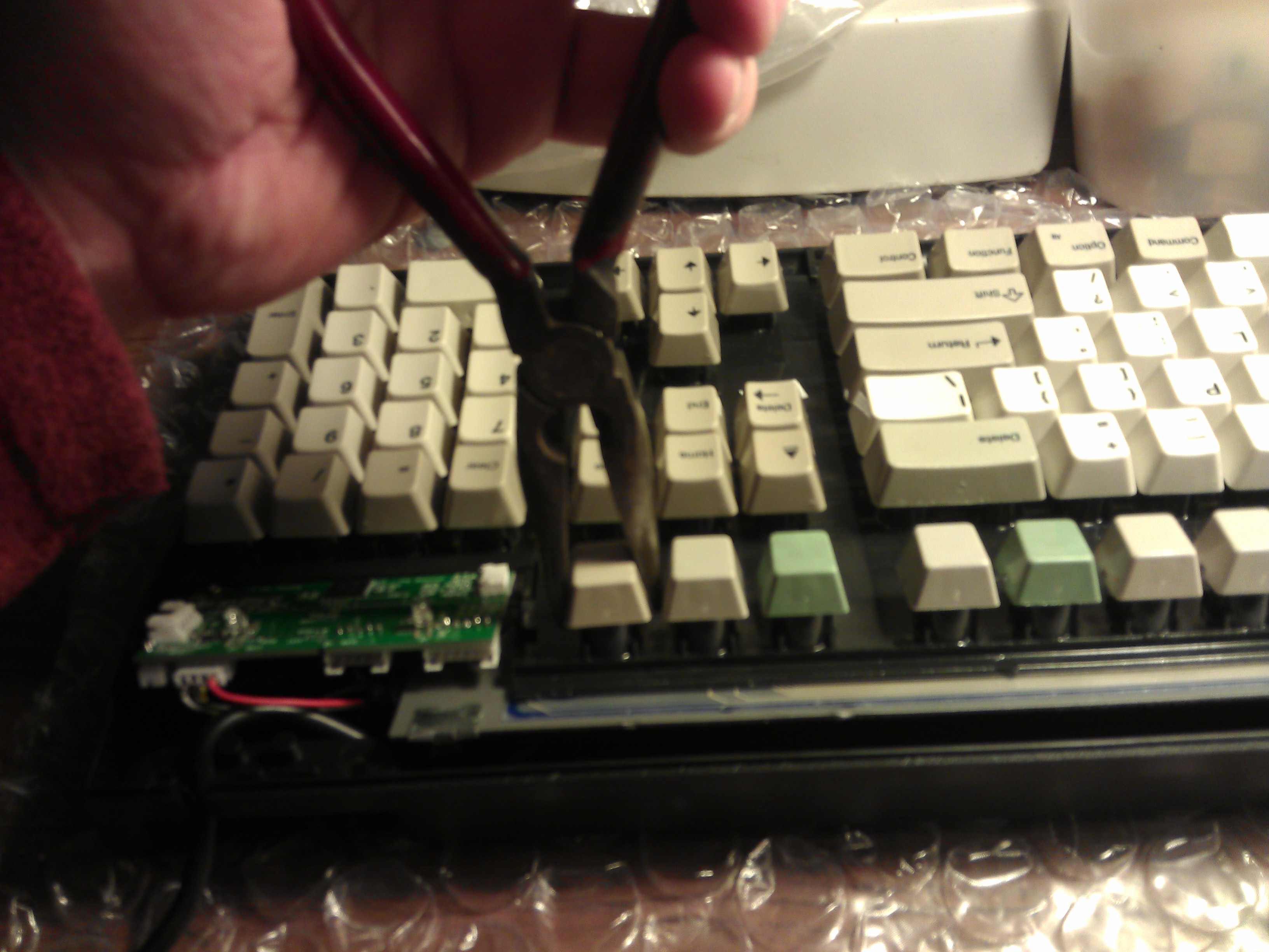 Removing plastic keys from new keyboard.jpg