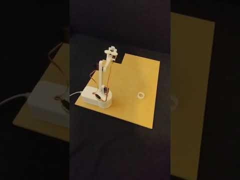 Robotic arm picking up, and moving eraser