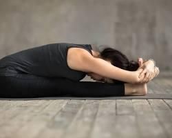 Seated Forward Fold Paschimottanasana yoga pose.jpg