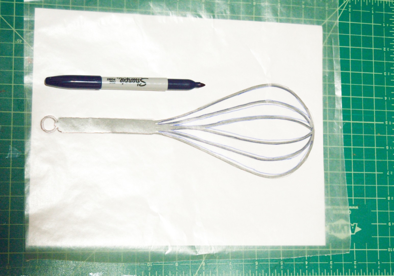 Step 3 _tracing the utensils design on wax paper.jpg