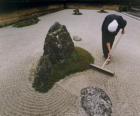 a-monk-rakes-gravel-in-kyotos-ryoanji-zen-garden,ng967368.jpg