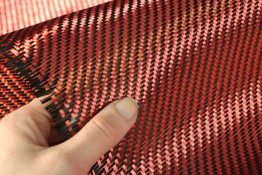 carbon-fibre-22-twill-3k-210g-red-in-hand-close-up.jpg