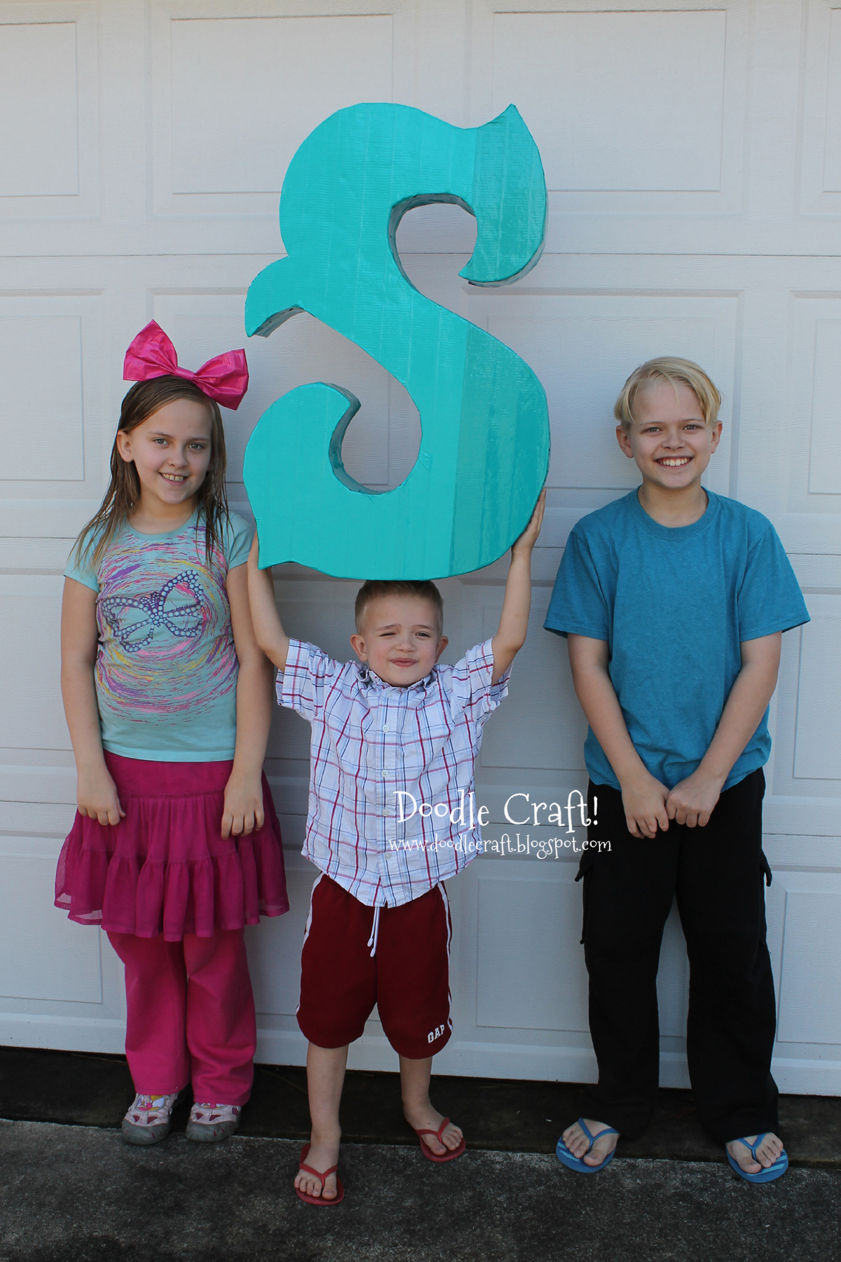 cardboard and tape simple monogram carnival style letter.jpg
