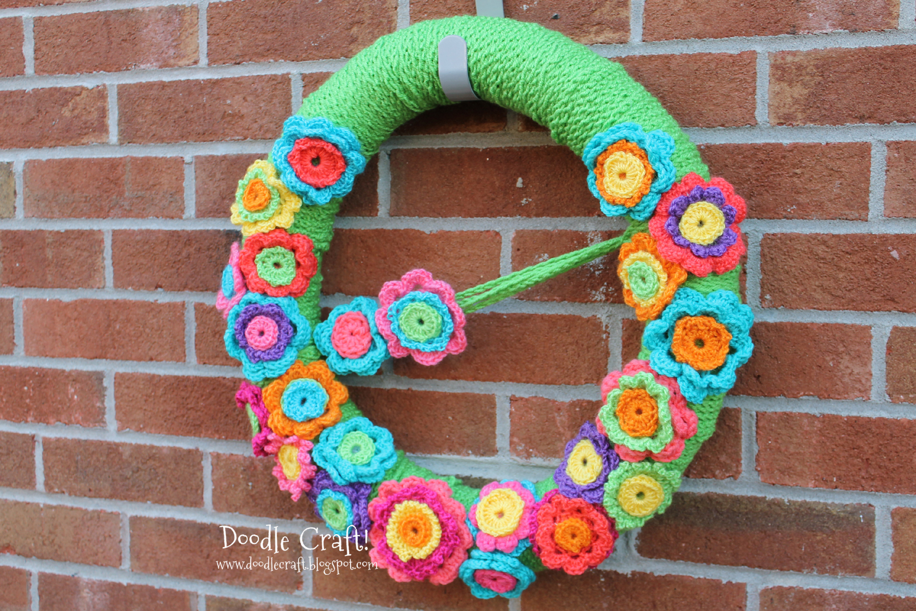 crocheted wreath from rosettes and chain stitches.jpg