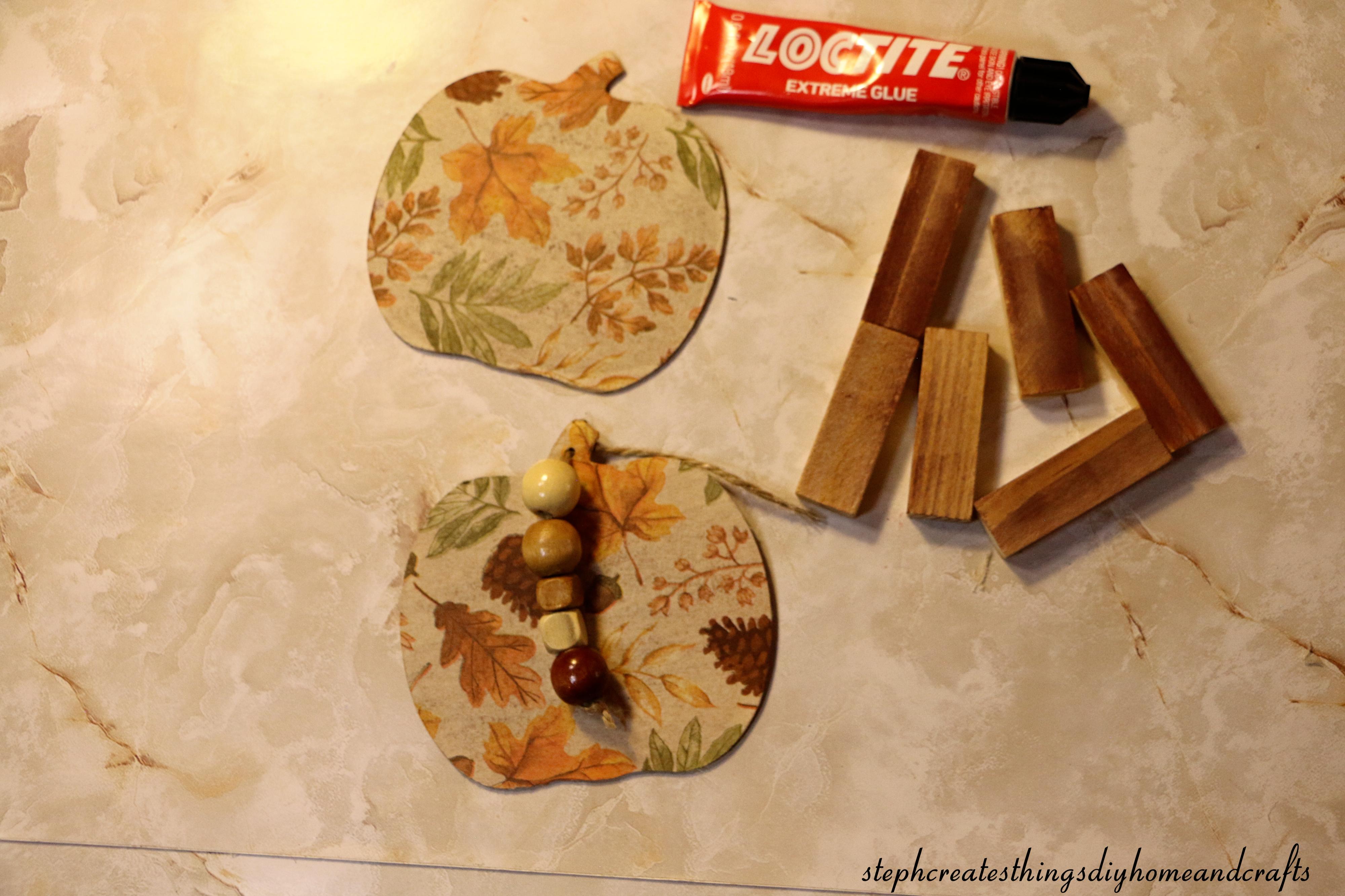 decoupaged wooden pumpkins, wooden blocks, and adhesive.jpg