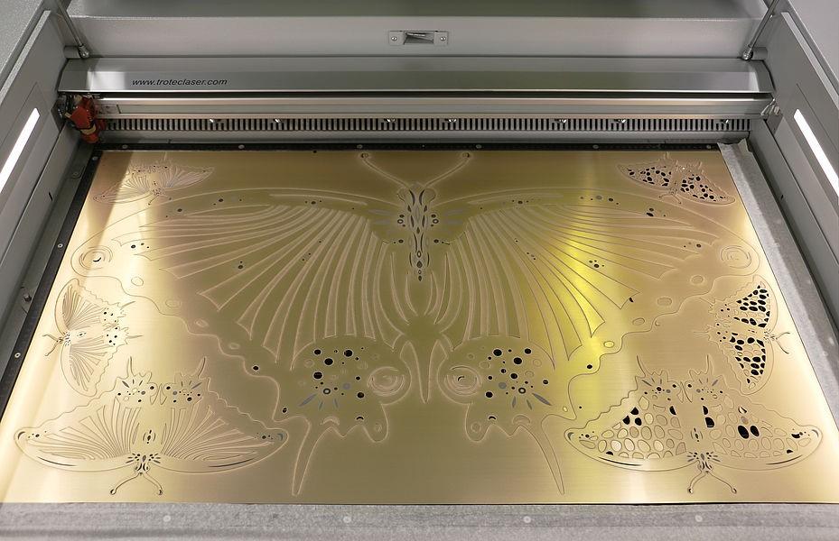 gold cut butterfly app laser bed.jpg