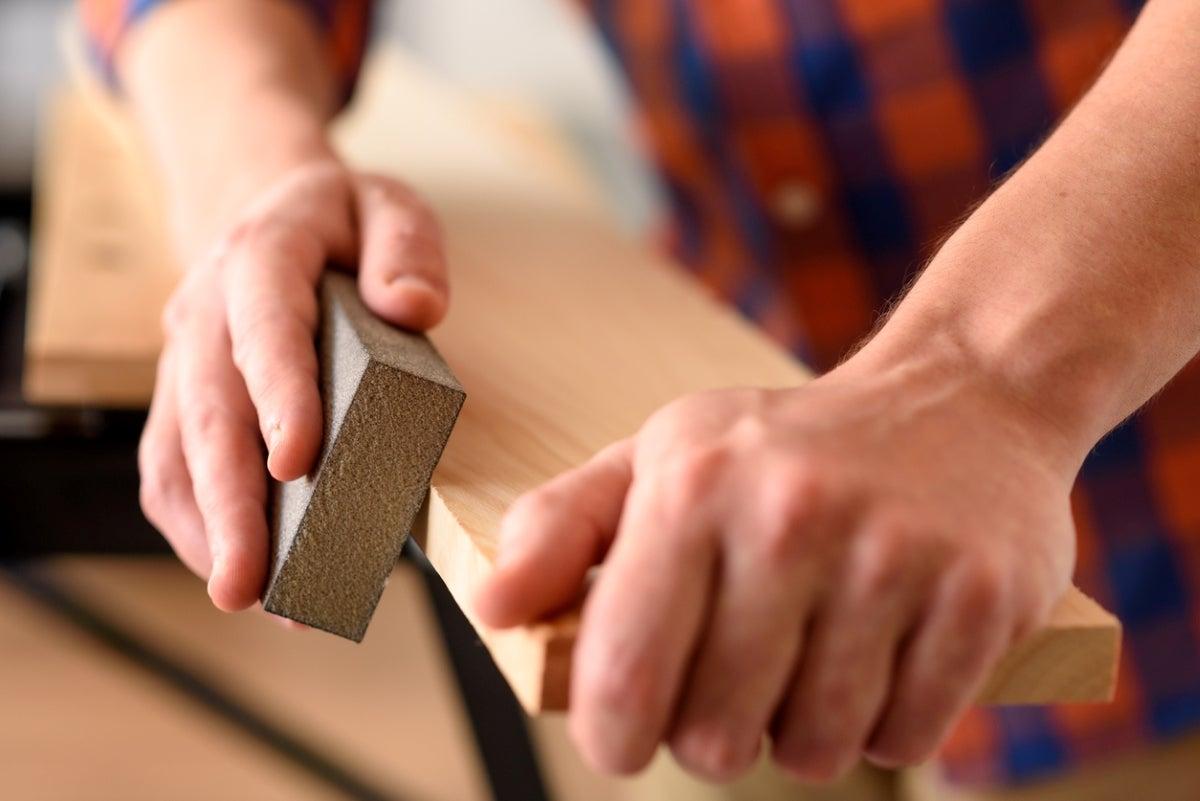 iStock-1303154686-how-to-sand-wood-hands-using-sanding-block.jpg