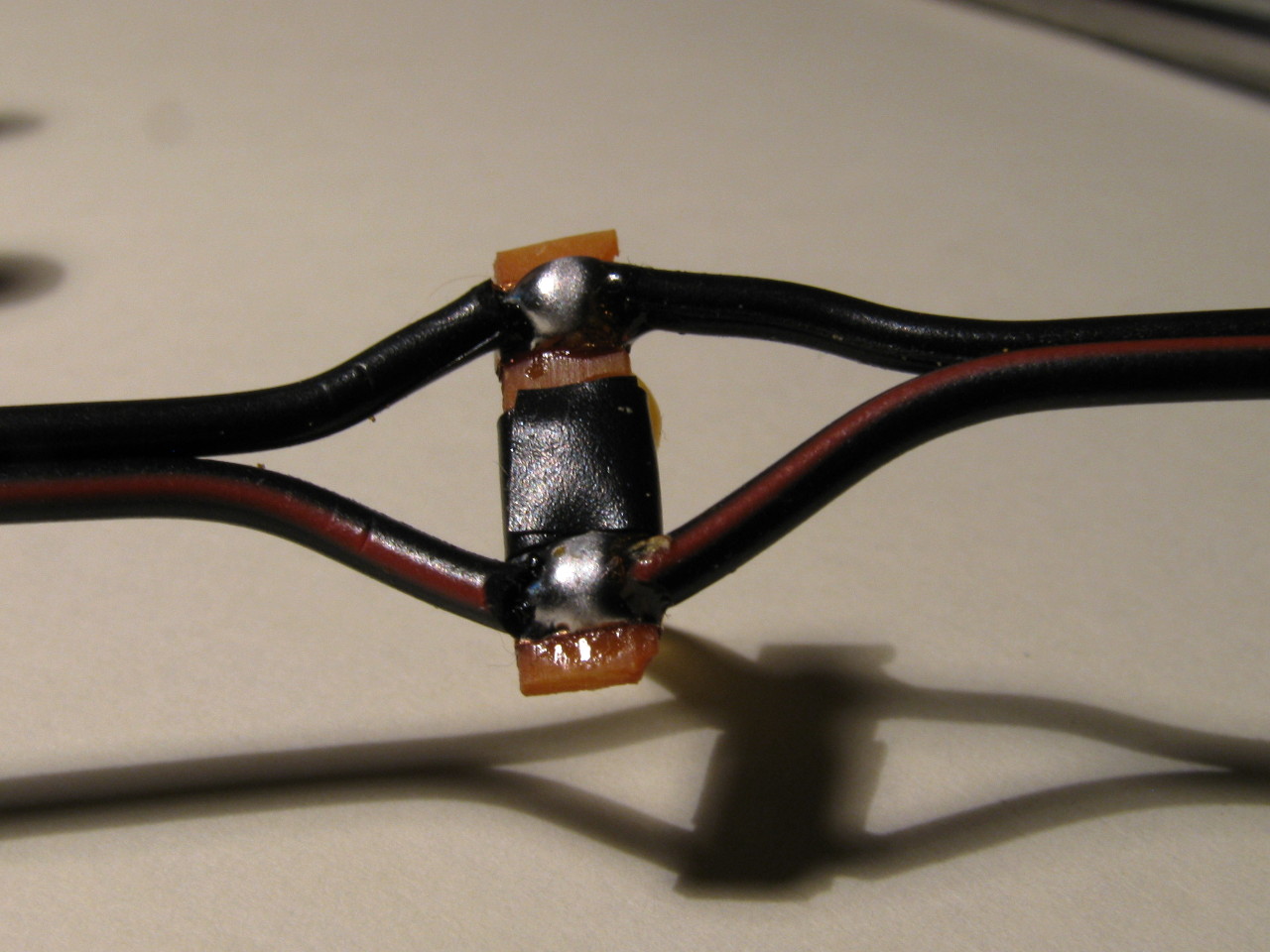 light_soldered_to_cable_taped_in_middle.jpg