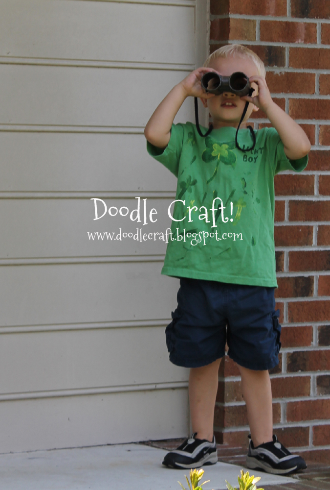 little boy spies toilet paper binoculars.jpg