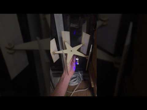 pivoting blade vertical axis wind turbine