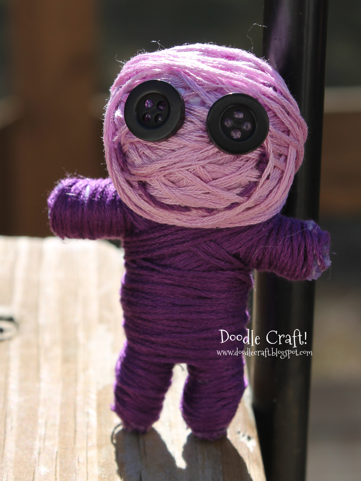 purple button eyed string voodoo doll.jpg