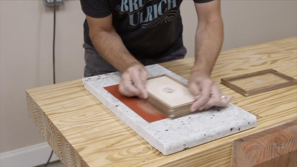 sanding-by-hand-granite-plate.jpeg