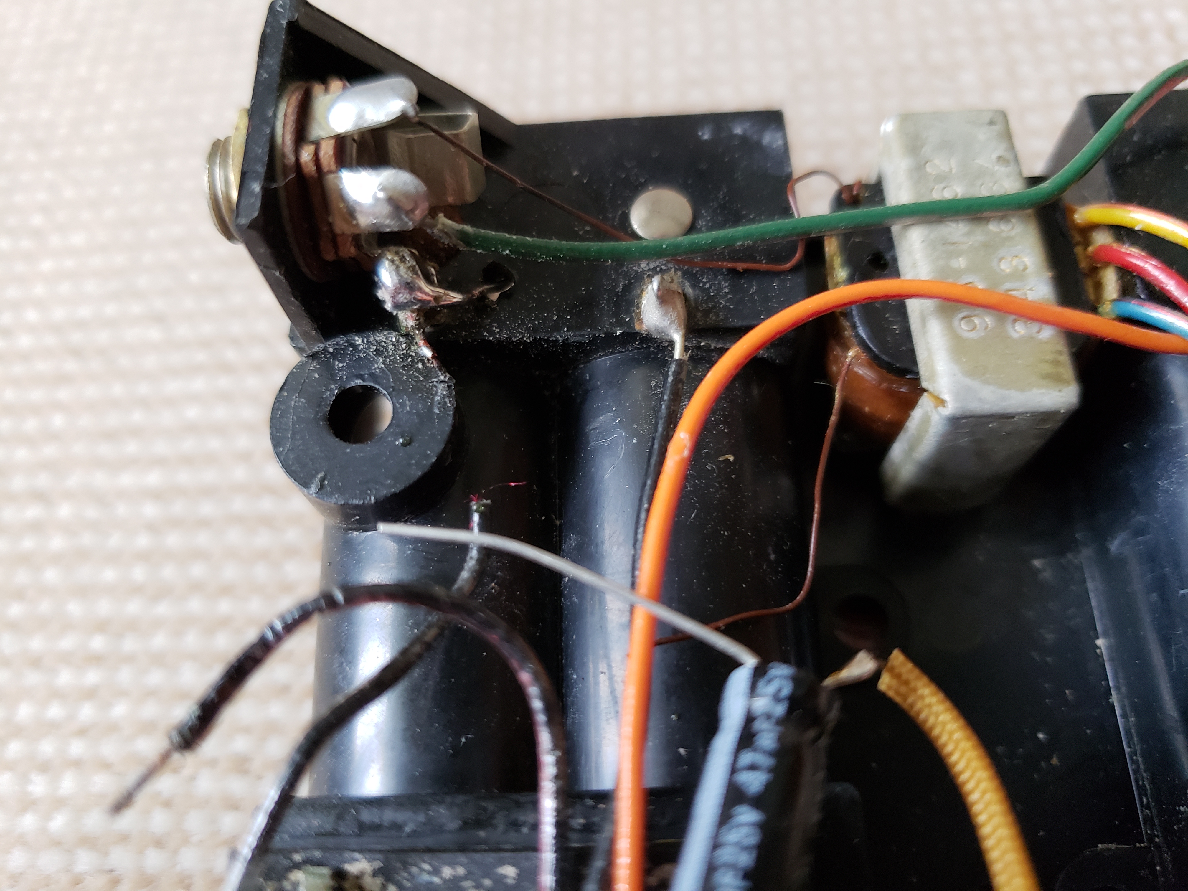 speaker side of radio showing drill hole and electrical attachment.jpg