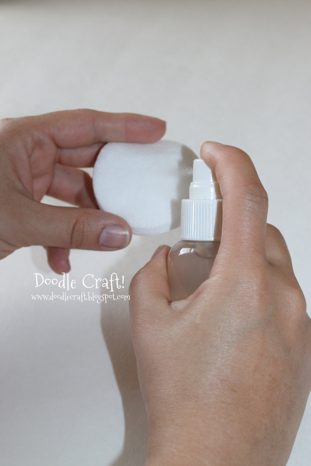 spray the facial toner diy on cotton round.jpg