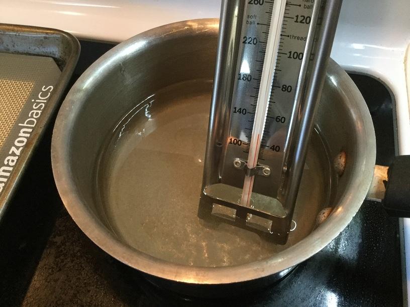 sugar syrup with candy thermometer.jpg