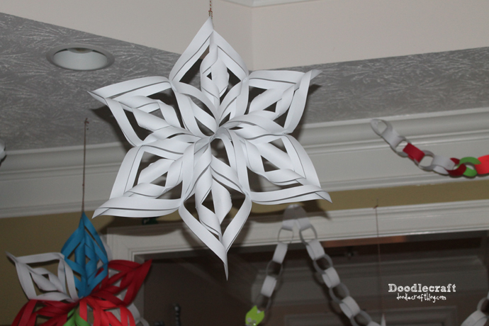 paper chains and decorating for Christmas with paper craft 3d snowflakes how to cut and hang (8).JPG