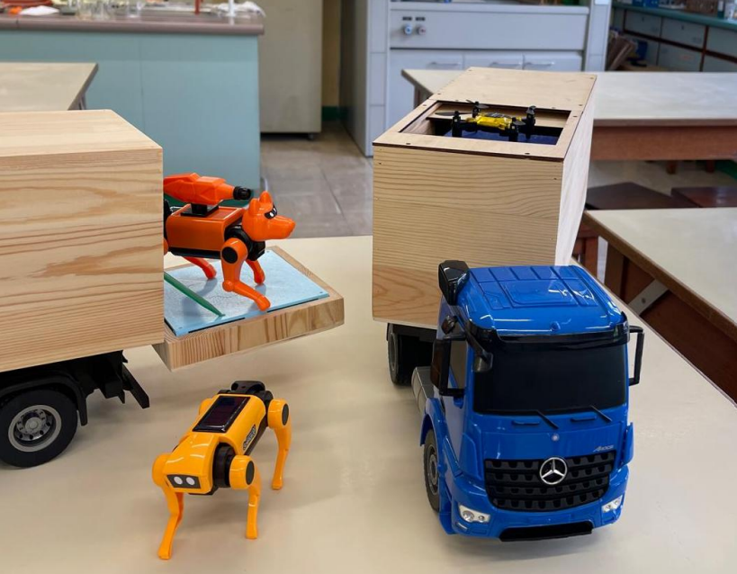 The Innovated Battery-Powered Trucks Carrying Drones and Robotic Dogs