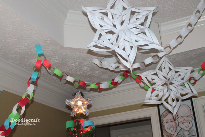 paper chains and decorating for Christmas with paper craft 3d snowflakes how to cut and hang (3).JPG