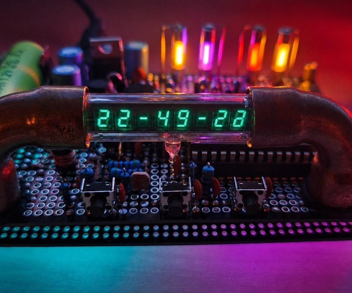 Single-AA NiMH VFD Clock From a Recycled Calculator Display