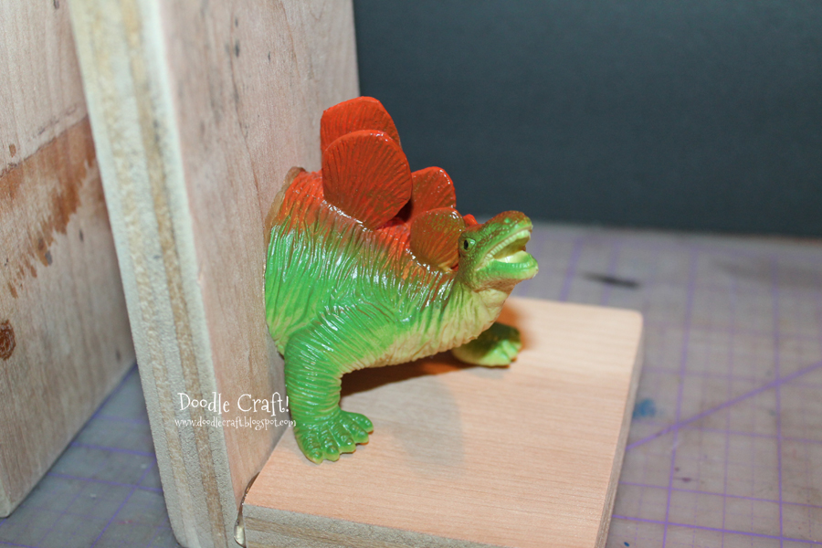 dinosaur toy book ends diy make your own teal aqua spray painted kids toys crafts activities projects t-rex stegosaurus toys plastic and wood upcycle (11).JPG