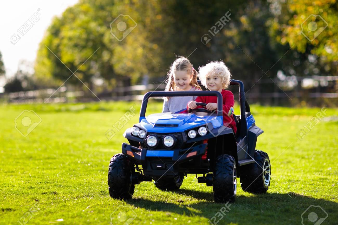 116565280-kids-driving-electric-toy-car-in-summer-park-outdoor-toys-children-in-battery-power-vehicle-little-b.jpg