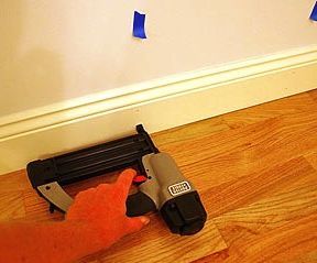 Nailing Baseboard Panel With a Nailer Instead of Hammer